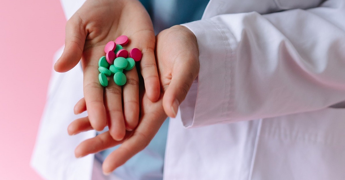 A medic holding contraceptive pill in Manchester 